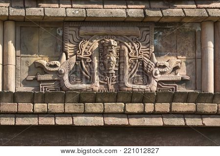Ancient Etchings and Sculptures Reproduction on Wall inside a Park in Italy.