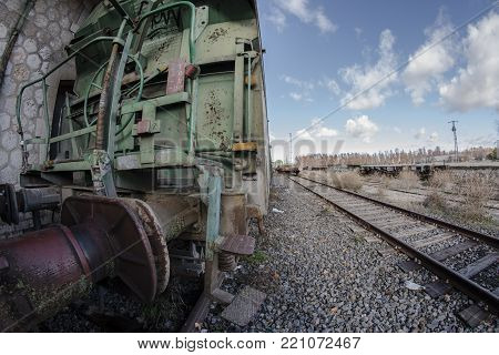 Urbex. Beggar Durmiento Between Rusty And Abandoned Train Carriages