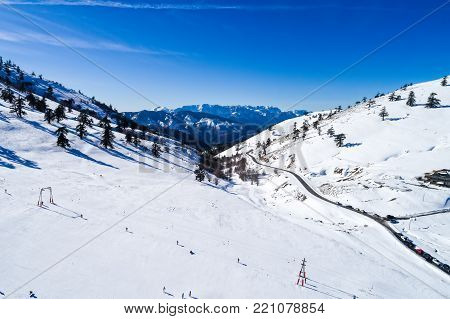 Aerial View Of Skiers At Ski Resort Vasilitsa In The Mountain Range Of Pindos, In Greece.