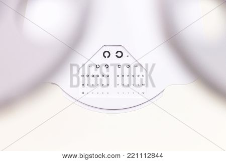 the cabinet of the eye doctor. eye sight test called landolt C. with copy space