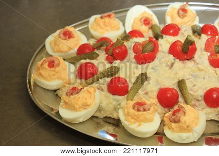 Olivier scrimp salad with pickles, tomatoes and eggs