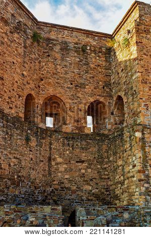 Ancient fortress walls in warm colors. Vertical photography.