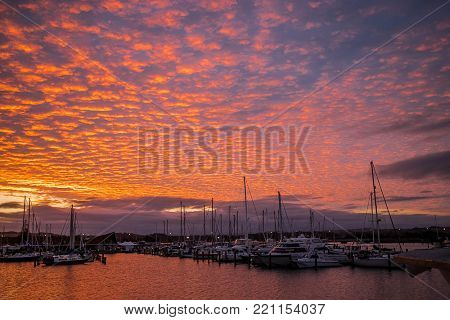 yachts and ships in marina at sunset, ahuriri, napier, new zealand