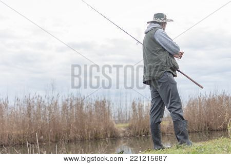 A man enjoys in the free time he spends himself on fishing