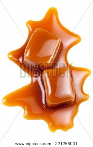 Toffee caramel candies close-up isolated on white background with copy space, macro.