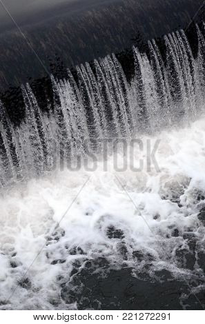 A Picture Of The Flowing Water. The Dam Is Designed To Regulate The Water Level In Rivers Within The
