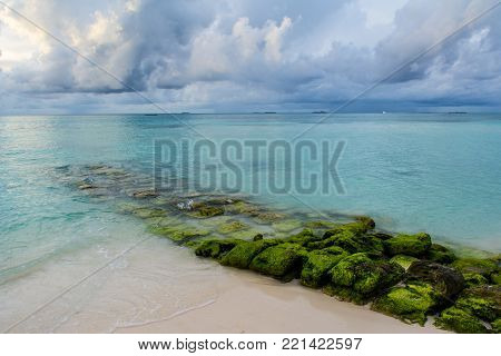 Beautiful cloudy stormy landscape of the beach landscape in Indian Ocean, Maldives