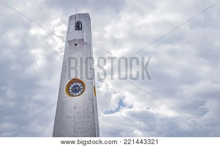 GUATAVITA CUNDINAMARCA, COLOMBIA - DECEMBER 26, 2017: The clock in the tower of the church of Guatavita