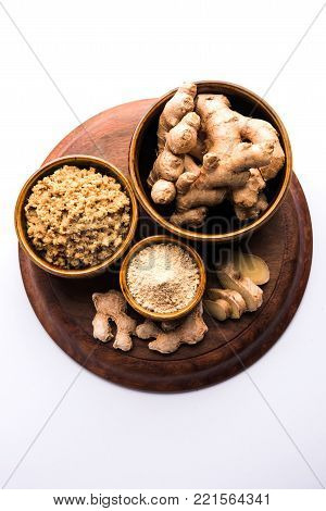 Ginger paste and powder also known as sunth or sonth with whole dried and fresh ginger, selective focus