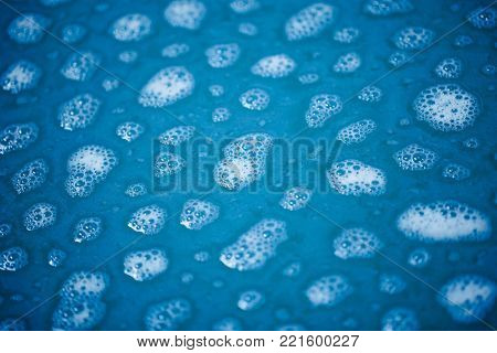 foam spots on blue water