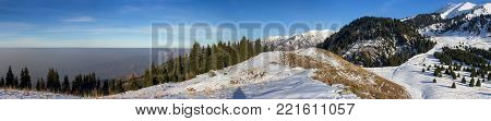 Foggy sunset in the Kazakhstan mountains. Winter landscape