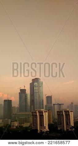 beautiful scenery of town with some building or skyscraper in it in the morning