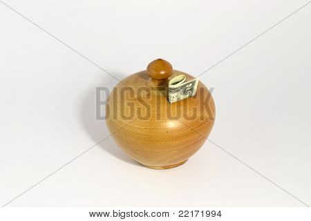 Salvadanaio con una banconota da 2 dollari