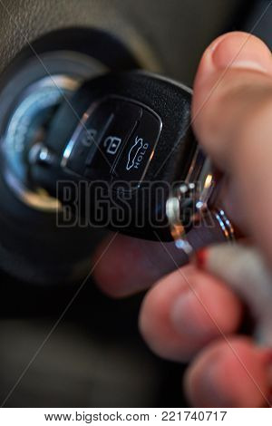 Close-up of car ignition. Man start modern car