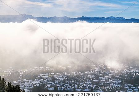 Peissenberg, Germany, under a thick layer of fog. View from the mountain