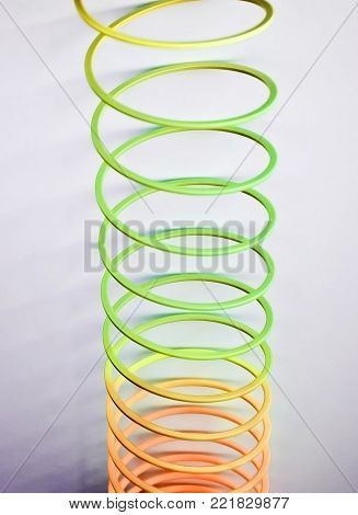 Dynamic Multicolored Vertical Spiral Spring being stretched