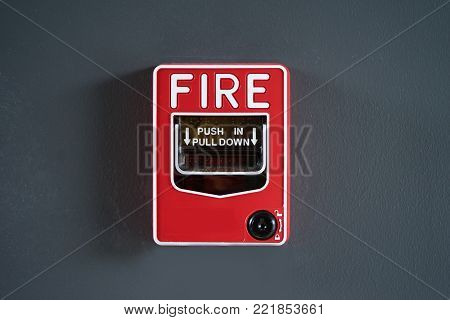 fire break glass on gray wall.safty first.
