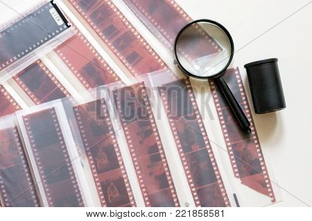 Color film in the sliver and magnifier on a white background