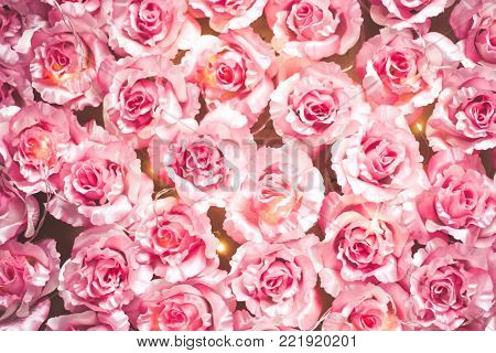 Pink roses bouquet and hearts bokeh background symbolizing love and passion, Valentines Day Womans Day card