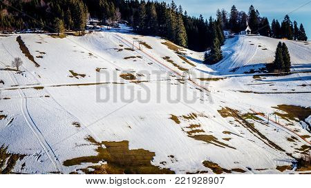 Due to the global warm up it becomes harder for the ski area's to guarantee snow. The ski slopes in the black forest often look like this where there is not enough snow to exercise the ski sport.