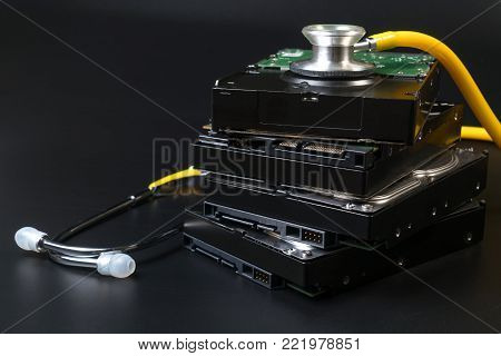 Internal Sata Type Hard Disk Drive And Stethoscope With Copy Space On Black Background For Protect D
