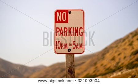 No Parking Sign With Mountains Bright Day