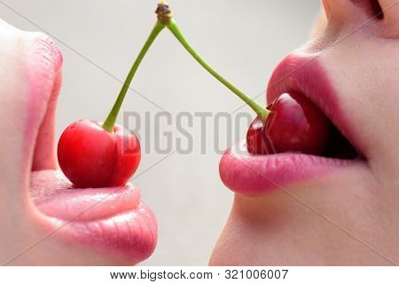 Taste. Closeup Of Women Mouths Kissing. Two Beautiful Sexy Lesbians In Love. Girls Friends. Fruit Li