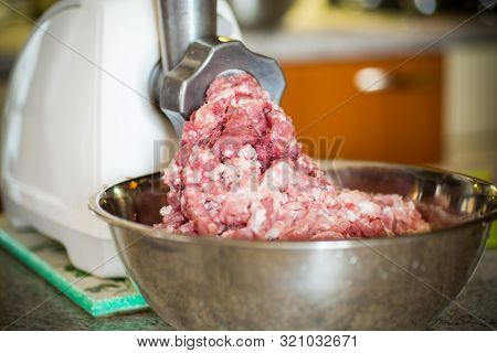 An Electric Meat Grinder Twists The Meat