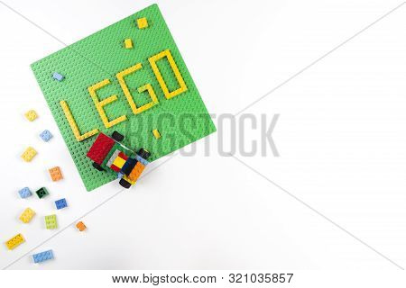Vilnius, Lithuania - 17 August, 2019: Word Lego On Green Baseplate And Colorful Lego Blocks On White