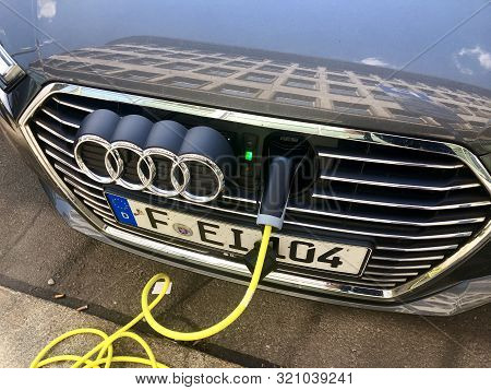 An Audi A3 E-tron Plug-in Hybrid Car Charging In The Streets Of Leipzig, Germany.