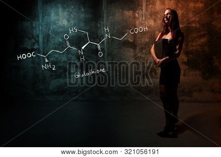 Sexy Girl Or Secretary Or Female Student Presenting Handdrawn Chemical Formula Of Glutathione Antiox