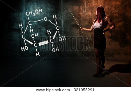 Sexy Girl Or Secretary Or Female Student Presenting Handdrawn Chemical Formula Of Glucose