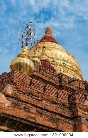 Vertical Picture Of The Top Of Ancient Buddhist Dhammayazika Pagoda During Blue Sky Day, Landmark Of
