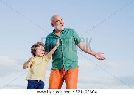 Two Generation - Weekend Together. Two Different Generations Ages: Grandfather And Grandson Together