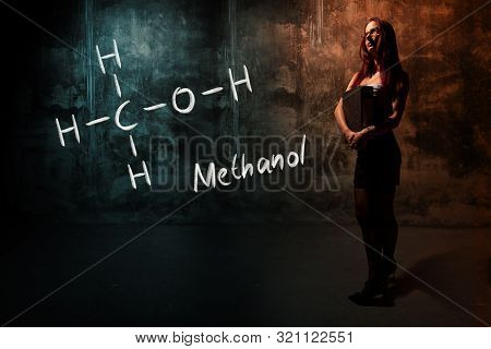 Sexy Girl Or Secretary Or Female Student Presenting Handdrawn Chemical Formula Of Methanol