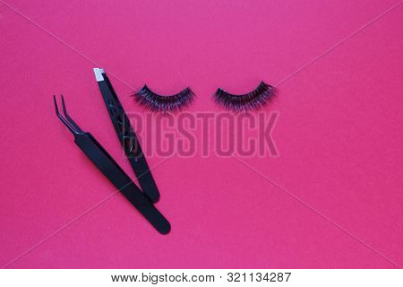 False Eye Lashes, Black Tweezers On Pink Background With Copy Space, Mockup. Beauty Concept - Tools 