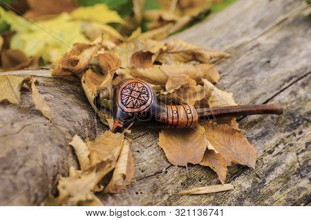 A Tube For Smoking, Made Of Clay, Using Trypillian Ornament. Autumn Photo