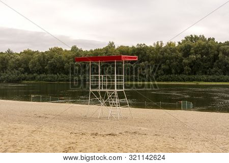 Rescue Tower And Fenced Beach On The River.