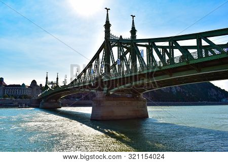Budapest, Hungary - August 21, 2019: Liberty Bridge Over The Danube River In The Sunshine. Danubius 