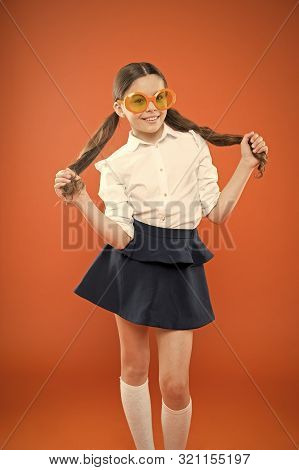 I Am A Girl And I Am Smart. Little Smart Schoolgirl On Orange Background. Adorable Child With Smart 