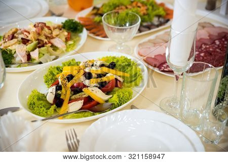 Close Up Of Food And Water Glasses At Restaurant