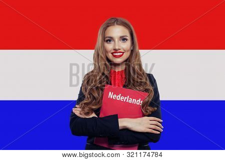 Learn Netherlandish Language. Happy Woman Student With Book Against The Netherlands Flag Background.
