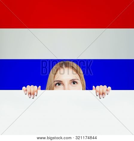 Love Netherlands! Happy Woman Smiling And Showing White Banner On Netherlandish Flag Background