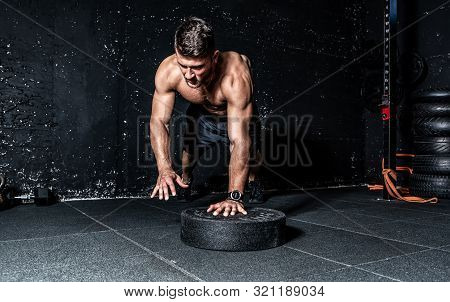 Push Ups Training, Young Strong Sweaty Focused Fit Muscular Man With Big Muscles Doing Push Ups With