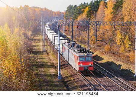 Refrigerated Container Train On Autumn Forest Background.