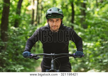 Aims And Destinations. Concentrated Young Cyclist Heading To Finish Line, Woods Baclground, Copy Spa
