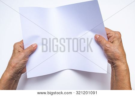 Senior Woman's Hand Holding White Paper On White Background