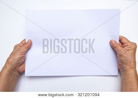 Senior Woman's Hand Holding White Paper On White Background