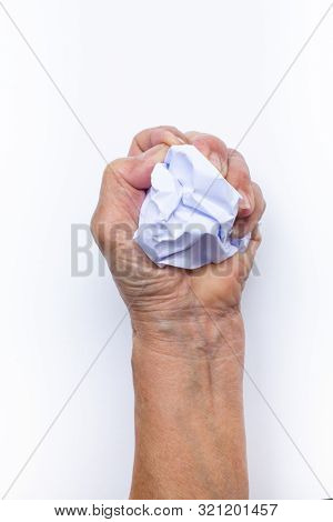 Senior Woman's Hand Crumpling White Paper Isolated On White Background, Angry Mood