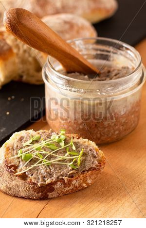 Food Concept French Beefs Rillettes  Spread On Homemade Crusty Artisan Ciabatta Bread With Flax Micr